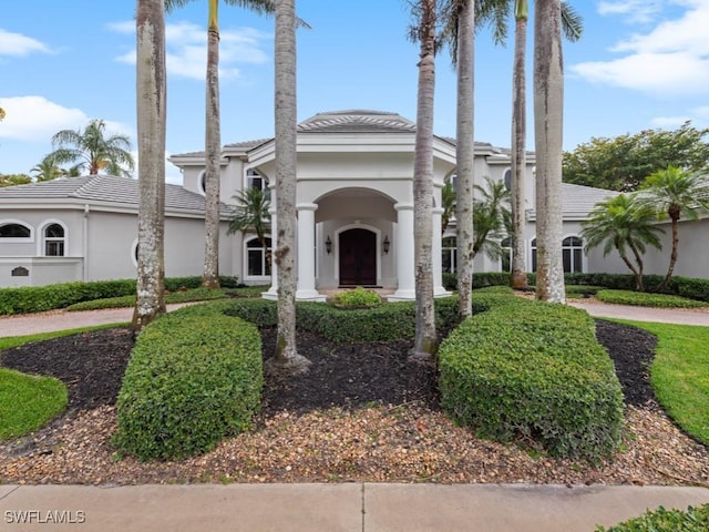 4244 Brynwood Dr, Naples, FL 34119 - greek revival house featuring stucco siding and a tile roof