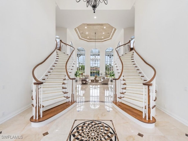 4244 Brynwood Dr, Naples, FL 34119 - entryway featuring stairs, crown molding, baseboards, and an inviting chandelier