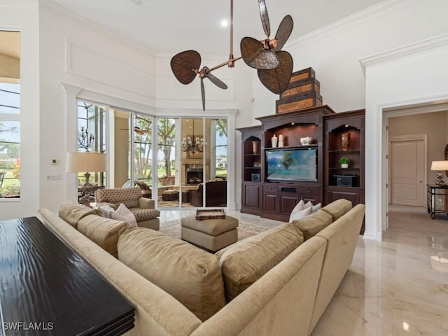 4244 Brynwood Dr, Naples, FL 34119 - living area with marble finish floor, a towering ceiling, and crown molding