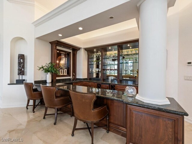 4244 Brynwood Dr, Naples, FL 34119 - bar with a sink, indoor wet bar, baseboards, and recessed lighting