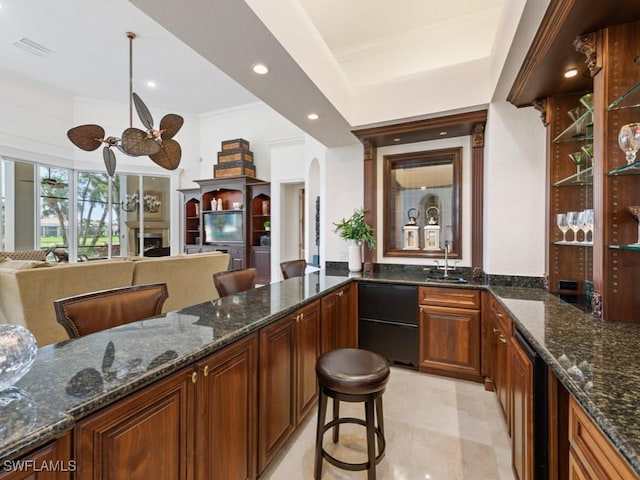 4244 Brynwood Dr, Naples, FL 34119 - bar with visible vents, ornamental molding, recessed lighting, arched walkways, and a sink