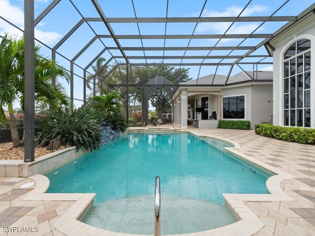 4244 Brynwood Dr, Naples, FL 34119 - outdoor pool featuring glass enclosure and a patio