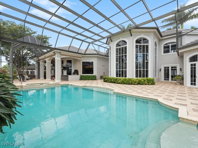 4244 Brynwood Dr, Naples, FL 34119 - outdoor pool featuring a patio, french doors, and glass enclosure