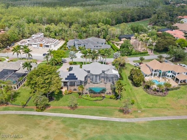 4244 Brynwood Dr, Naples, FL 34119 - bird's eye view with a wooded view and a residential view