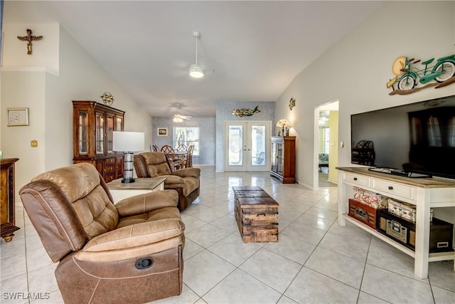 living area featuring french doors, light tile patterned floors, high vaulted ceiling, and ceiling fan