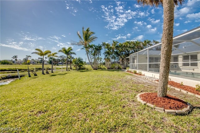view of yard with a lanai