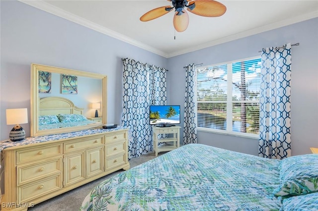 bedroom featuring carpet floors, a ceiling fan, and crown molding
