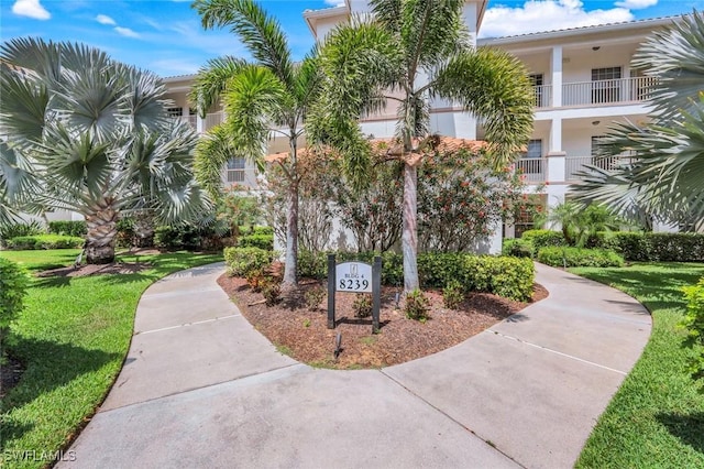 surrounding community with a lawn