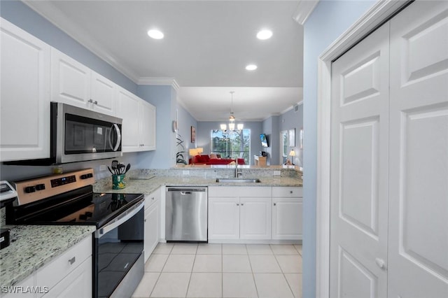 kitchen featuring crown molding, recessed lighting, light tile patterned floors, stainless steel appliances, and a sink