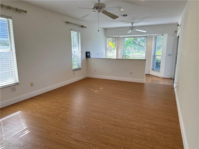 4830 Shearwater Ln, Naples, FL 34119 - unfurnished room featuring wood finished floors, visible vents, baseboards, and ceiling fan