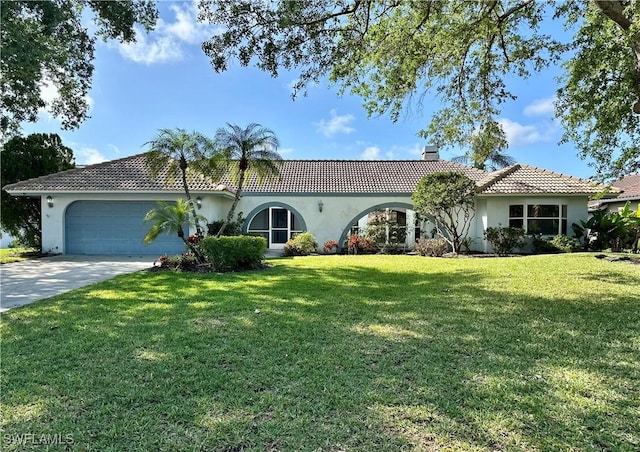 4830 Shearwater Ln, Naples, FL 34119 - view of front of house with a tile roof, concrete driveway, a chimney, a front lawn, and a garage