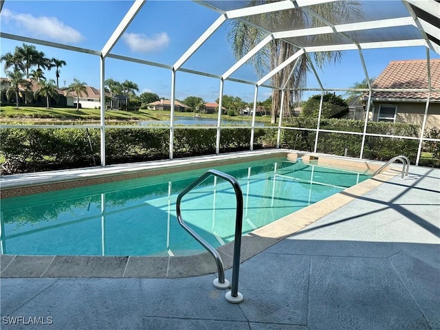 4830 Shearwater Ln, Naples, FL 34119 - outdoor pool with glass enclosure, a water view, and a patio area