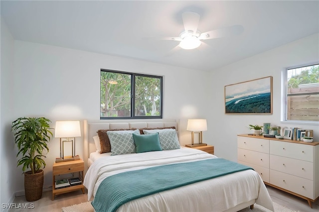 bedroom featuring a ceiling fan and light wood finished floors