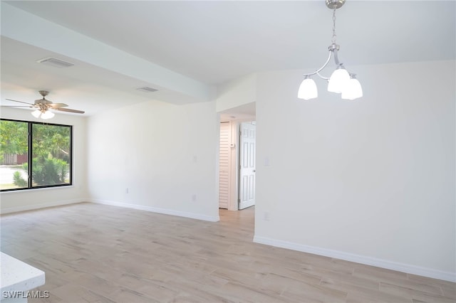 unfurnished room with baseboards, ceiling fan, visible vents, and light wood-type flooring