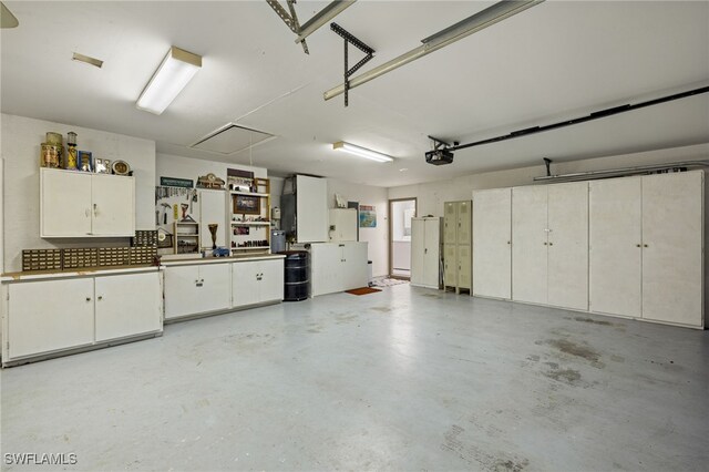 3701 Bali Ln, Estero, FL 33928 - garage featuring a garage door opener