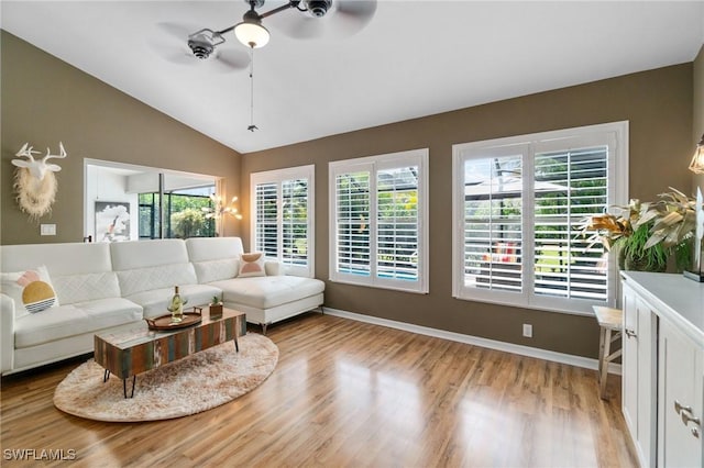 3701 Bali Ln, Estero, FL 33928 - living room featuring light wood-style flooring, baseboards, lofted ceiling, and ceiling fan
