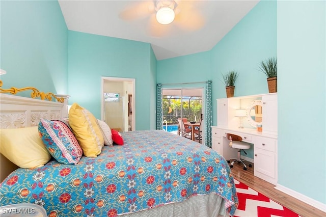 3701 Bali Ln, Estero, FL 33928 - bedroom with lofted ceiling, ensuite bath, access to exterior, ceiling fan, and wood finished floors