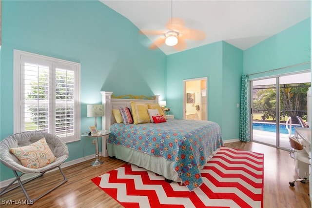 3701 Bali Ln, Estero, FL 33928 - bedroom with baseboards, wood finished floors, lofted ceiling, access to exterior, and ensuite bath
