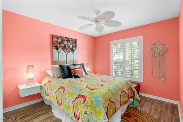 3701 Bali Ln, Estero, FL 33928 - bedroom with baseboards, wood finished floors, and a ceiling fan