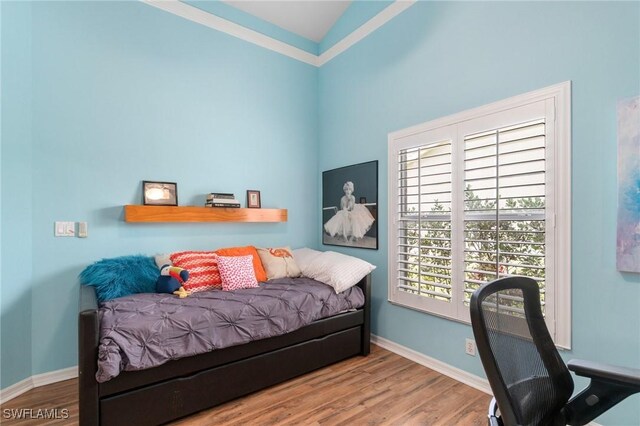 3701 Bali Ln, Estero, FL 33928 - bedroom with baseboards and wood finished floors