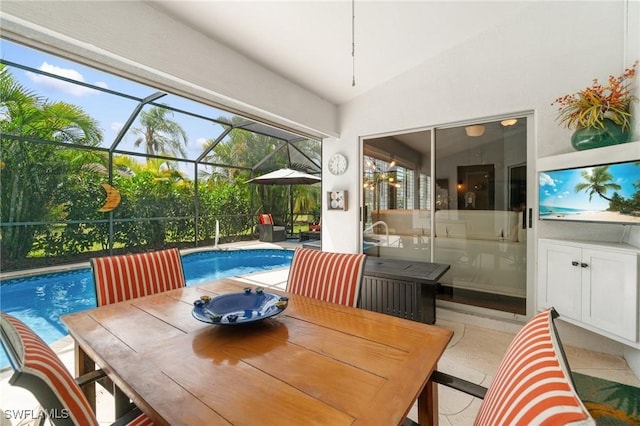 3701 Bali Ln, Estero, FL 33928 - exterior space featuring glass enclosure, outdoor dining area, and an outdoor pool