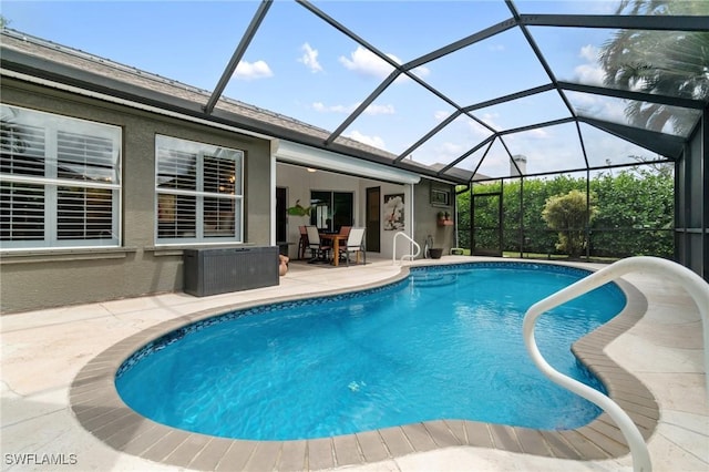 3701 Bali Ln, Estero, FL 33928 - pool with glass enclosure and a patio area