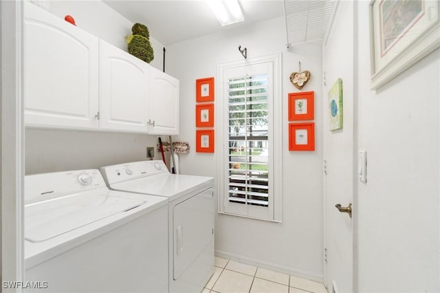3701 Bali Ln, Estero, FL 33928 - laundry room with washing machine and clothes dryer, cabinet space, baseboards, and light tile patterned flooring