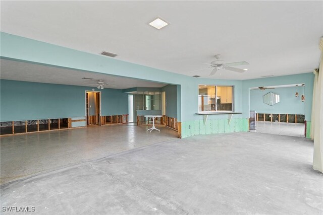 11915 Island Ave, Matlacha, FL 33993 - unfurnished living room featuring a ceiling fan, visible vents, and concrete flooring