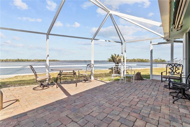 11915 Island Ave, Matlacha, FL 33993 - view of patio / terrace with a water view and glass enclosure