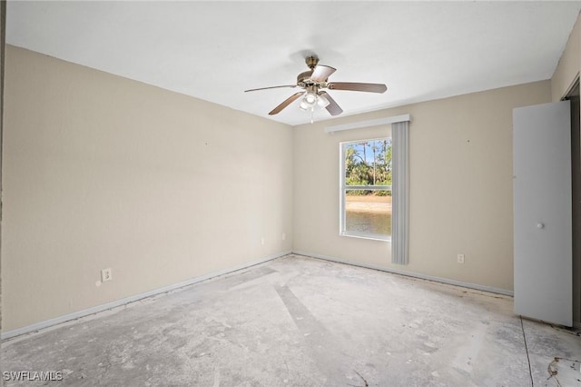 8245 Ibis Club Dr Unit 401, Naples, FL 34104 - empty room featuring unfinished concrete flooring and ceiling fan
