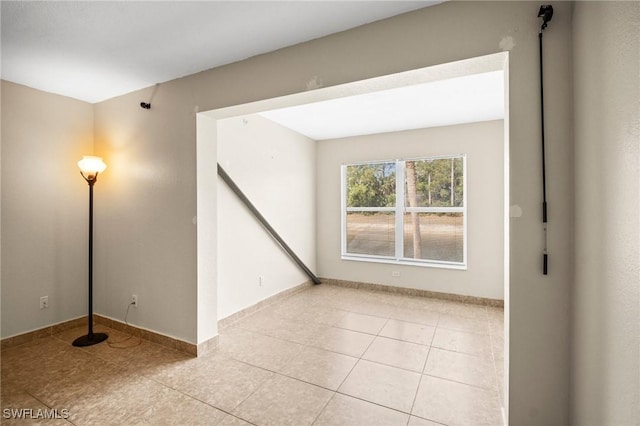 8245 Ibis Club Dr Unit 401, Naples, FL 34104 - empty room with light tile patterned floors and baseboards