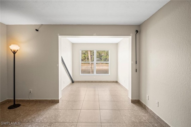 8245 Ibis Club Dr Unit 401, Naples, FL 34104 - unfurnished room with baseboards and tile patterned floors