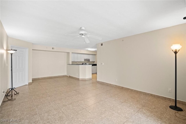 8245 Ibis Club Dr Unit 401, Naples, FL 34104 - unfurnished living room with baseboards and ceiling fan