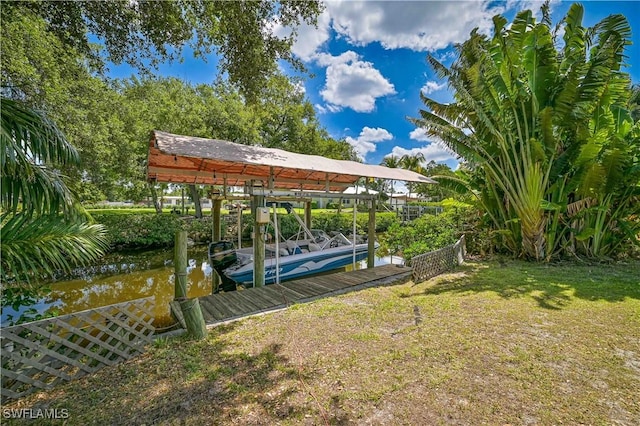 231 Kingston Dr, Fort Myers, FL 33905 - view of yard featuring boat lift and a boat dock