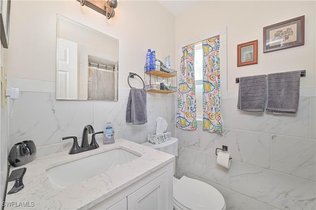 231 Kingston Dr, Fort Myers, FL 33905 - full bath with tile walls, vanity, and wainscoting