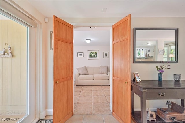 231 Kingston Dr, Fort Myers, FL 33905 - corridor with light tile patterned flooring and baseboards