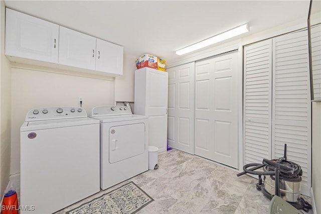 231 Kingston Dr, Fort Myers, FL 33905 - washroom with washing machine and dryer, cabinet space, and light marble finish floors
