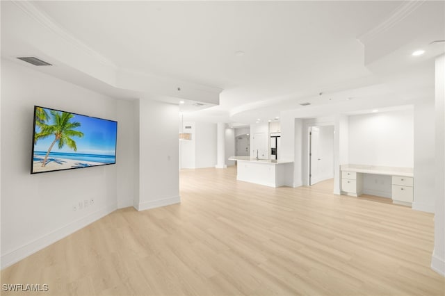 9123 Strada Pl Unit 7316, Naples, FL 34108 - unfurnished living room featuring light wood finished floors, baseboards, recessed lighting, and crown molding