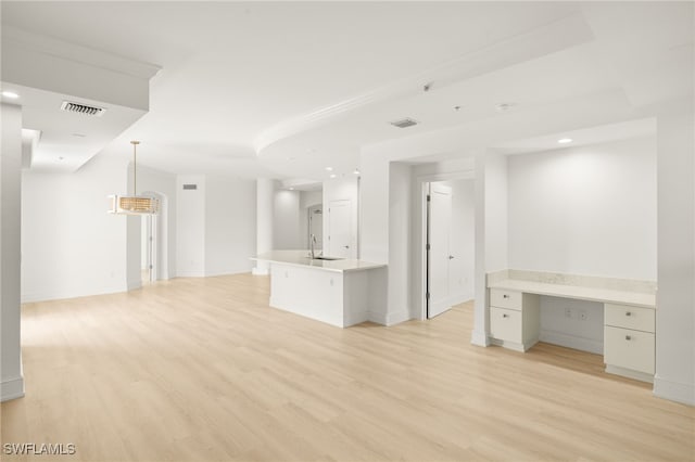 9123 Strada Pl Unit 7316, Naples, FL 34108 - unfurnished living room featuring a sink, light wood-style flooring, recessed lighting, and baseboards
