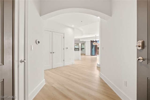 9123 Strada Pl Unit 7316, Naples, FL 34108 - hall featuring light wood-style flooring and baseboards