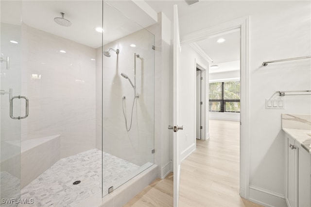 9123 Strada Pl Unit 7316, Naples, FL 34108 - bathroom with a shower stall, wood finished floors, recessed lighting, vanity, and baseboards