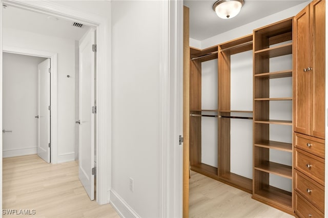 9123 Strada Pl Unit 7316, Naples, FL 34108 - spacious closet with light wood-style floors