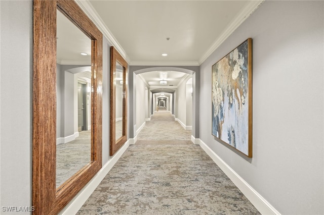 9123 Strada Pl Unit 7316, Naples, FL 34108 - hallway with arched walkways, crown molding, baseboards, recessed lighting, and carpet