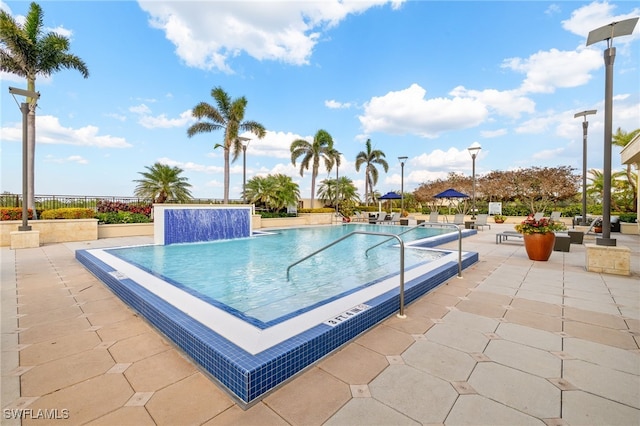 9123 Strada Pl Unit 7316, Naples, FL 34108 - community pool featuring a patio area and fence