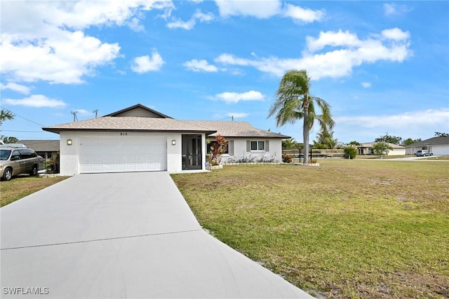 915 SW 36th St, Cape Coral, FL 33914 - ranch-style house featuring an attached garage, driveway, stucco siding, and a front lawn