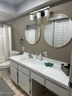 full bath featuring tile patterned floors, toilet, and vanity