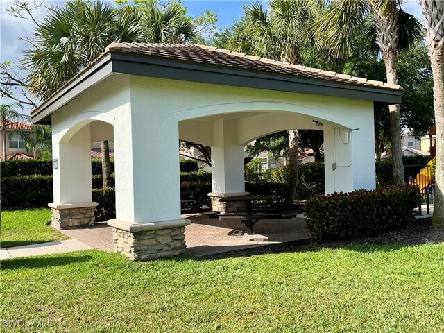 10327 Carolina Willow Dr, Fort Myers, FL 33913 - view of home's community with a lawn and a gazebo