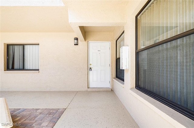 9648 Windsor Gardens Ln Unit 104, Fort Myers, FL 33919 - view of exterior entry with stucco siding