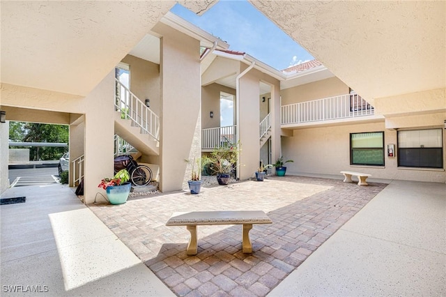 9648 Windsor Gardens Ln Unit 104, Fort Myers, FL 33919 - view of patio / terrace with stairs