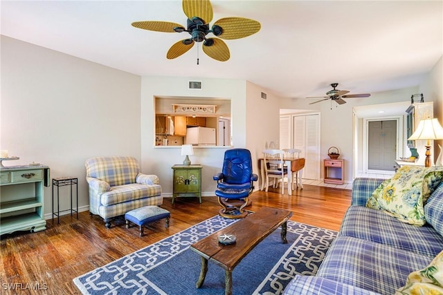9648 Windsor Gardens Ln Unit 104, Fort Myers, FL 33919 - living room featuring ceiling fan, wood finished floors, and baseboards